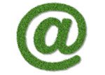 Icon of an at symbol in lush green grass